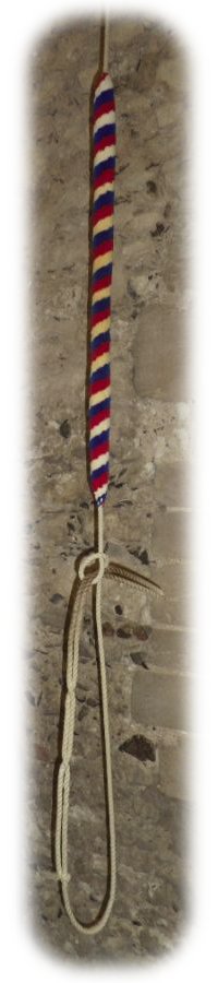 A bell rope with its red, white and blue sally